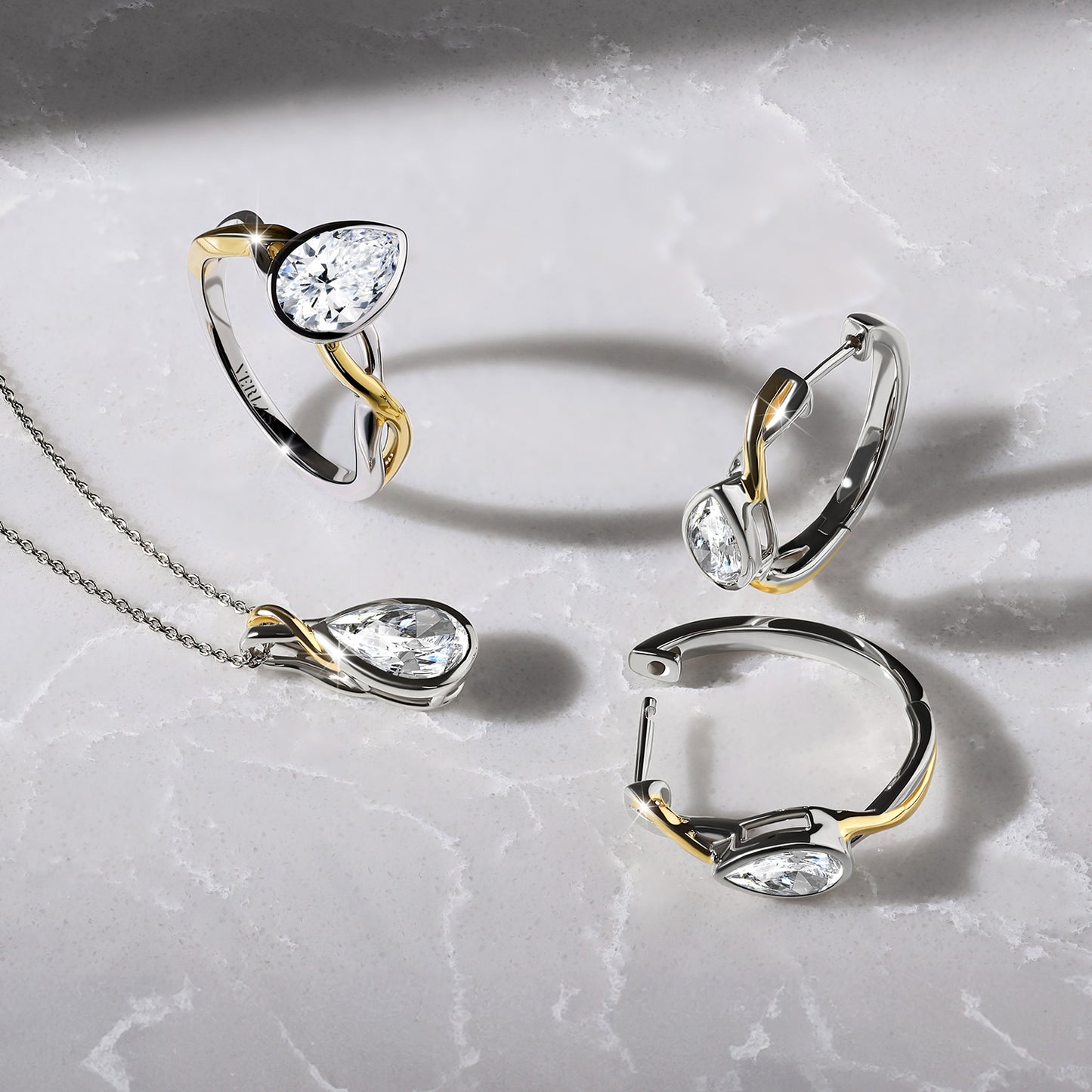 Twisted Bezel Pear Huggie Hoops